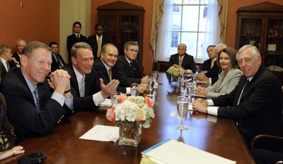 Speaker of the House Nancy Pelosi, D-Calif., and House Majority Leader Steny Hoyer, D-Md., right, pose before a meeting Thursday with, from left, Ford Motor Co. President and CEO Alan Mullally, General Motors CEO Richard Wagoner Jr., Chrysler Chairman and CEO Robert L. Nardelli, and United Auto Workers President Ron Gettelfinger on Capitol Hill.  (Associated Press / The Spokesman-Review)