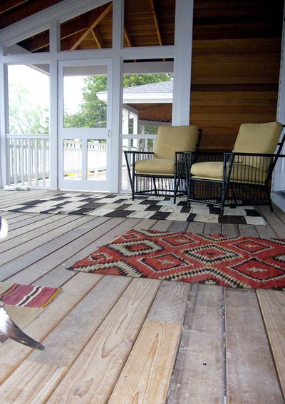 From left, the screened-in porch area of a lake home owned by a client of designer Betsy Burnham’s. Rugs can be a great way to delineate the space at an entryway. An imprinted concrete entryway of another home owned by a client of Burnham’s. Some designers suggest avoiding pale neutrals and solids in favor of slightly bolder colors, patterns and textures that hide dirt and signs of wear. The stone-tiled entryway of a lake home owned by a client of Burnham’s. It’s good to make entryways durable to withstand dripping umbrellas, muddy shoes and more.
