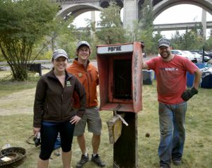 The team from GreenCupboards.com, a Spokane-company started by a student team from Gonzaga, participated in the Spokane River Cleanup Oct. 2, 2011 and received a prize for hauling a huge, heavy, phonebooth out of the River, and up a very steep bank.
 (Courtesy photo)