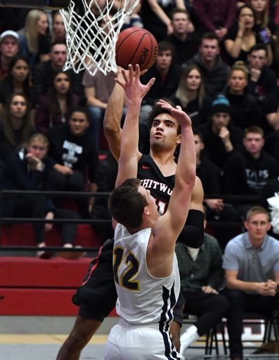 Whitworth guard Isaiah Hernandez shoots over Whitman’s Robert Colton during the first half of a Northwest Conference game Jan. 21 at Whitworth.  (Colin Mulvany/THE SPOKESMAN-REVIEW)