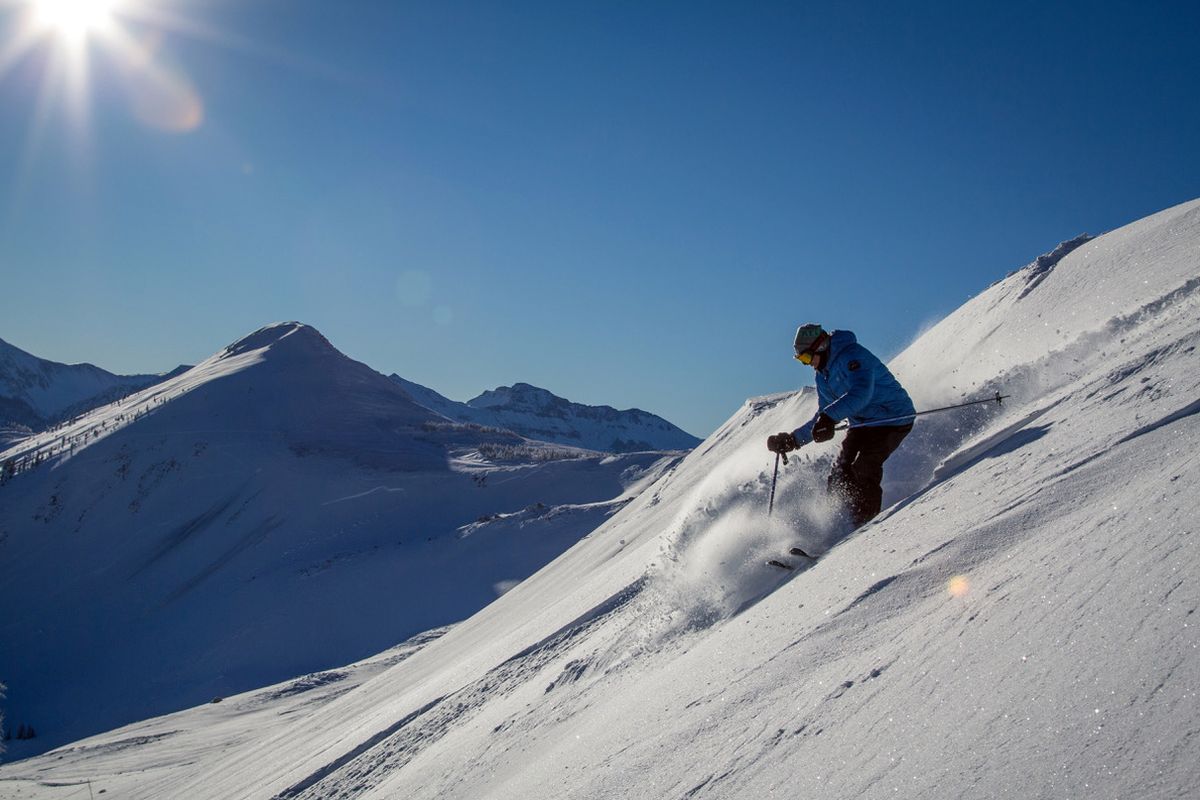 Skiing off the top of Wolf Creek, with Alberta Peak in the distance. (Samual Bricker courtesy of Wolf Creek Ski Area)