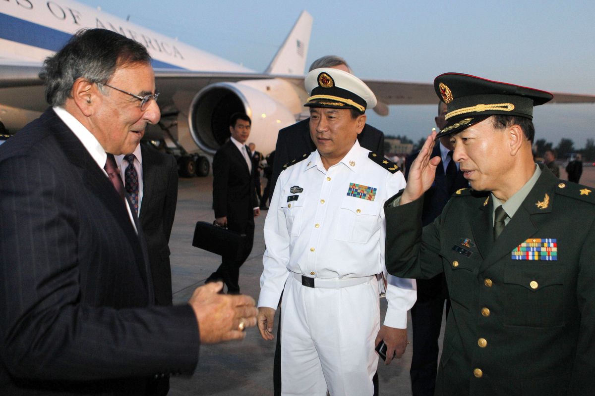 U.S. Secretary of Defense Leon Panetta, left, is welcomed by Chinese military leaders after his arrival at Beijing International Airport Monday, Sept. 17, 2012. Panetta is on his third trip to Asia in 11 months, reflecting the Pentagon