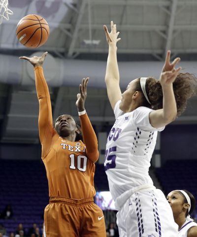 Texas guard Lashann Higgs (10) shoots as TCU guard Kianna Ray (25) defends during the first half of an NCAA college basketball game, Wednesday, Jan. 10, 2018, in Fort Worth, Texas. (Tony Gutierrez / Associated Press)
