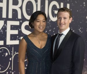 In this Nov. 9, 2014 file photo, Priscilla Chan and Mark Zuckerberg arrive at the 2nd Annual Breakthrough Prize Award Ceremony at the NASA Ames Research Center in Mountain View, Calif. Zuckerberg and his physician wife, Chan, are expecting a baby. (Photo by Peter Barreras]/Invision/AP, File)