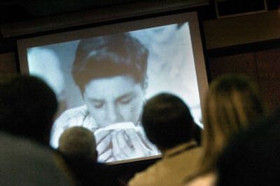
Community leaders watch a video Wednesday at the regional health district about recognizing the flu and treating patients. 
 (Christopher Anderson / The Spokesman-Review)