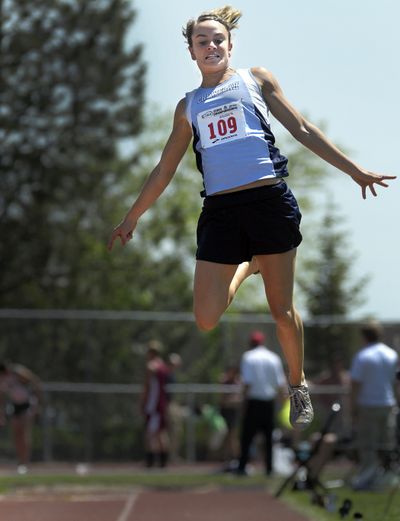 Liz Cobb of Chewelah flies over the long jump pit to win the event in the 1A meet at Cheney.   (CHRISTOPHER ANDERSON / The Spokesman-Review)