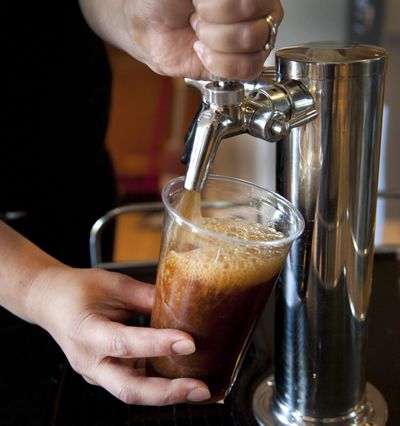 Beautiful Grounds, in Spokane’s Liberty Building, offers Nitro Coldbrew Coffee, which Joe Johnson calls the latest coffee craze. Spurred by the popularity of boutique coffee purveyors, Starbucks and other chains are taking steps to appeal to the growing ranks of coffee aficionados. (Dan Pelle / The Spokesman-Review)