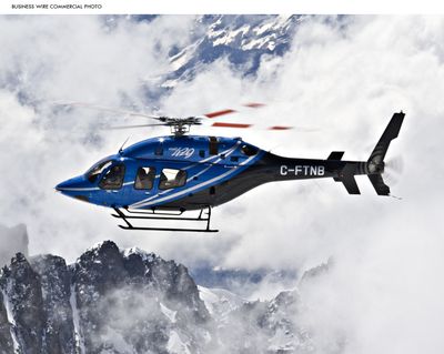The 429, a Bell helicopter manufactured by Textron, takes a high-altitude flight in the Swiss Alps. (Associated Press)
