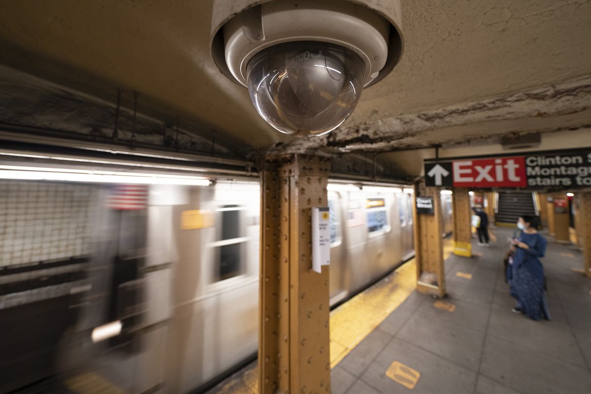 A video surveillance camera is installed on the ceiling above a subway platform in the Court Street station in the Brooklyn borough of New York in Oct. 2020. . State lawmakers across the U.S. are reconsidering the tradeoffs of facial recognition technology amid civil rights and racial bias concerns.  (Mark Lennihan)