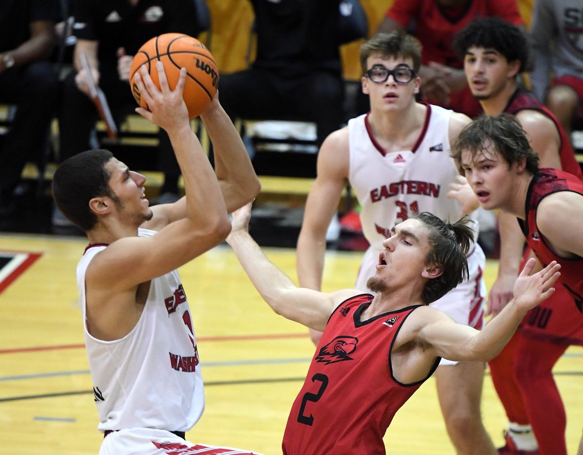 Eastern Washington guard Rylan Bergersen (11) lines up a shot as Southern Utah guard Aanen Moody (2) defends during the first half of a college basketball game, Thursday, Dec. 2, 2021, on Reese Court in Cheney, Wash.  (COLIN MULVANY/THE SPOKESMAN-REVIEW)