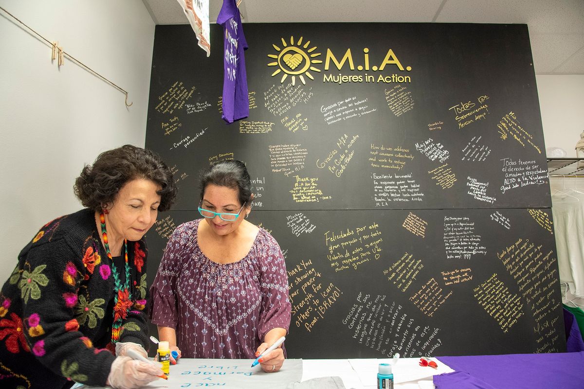 Margarita Plascencia, left, and Ana Garza collaborate Friday on a T-shirt they are designing to be part of a display at the MIA offices in Spokane.  (Jesse Tinsley/The Spokesman-Review)