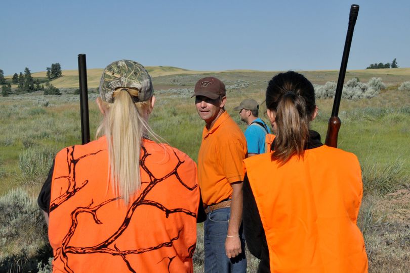 Dog trainer Dan Hoke addresses hunter education students – most of whom are female – in a field session geared to hunting upland birds. The number of girls and women enrolling in Spokane-area hunter education courses has dramatically increased in the past 15 years, said course organizer Jack Dolan.