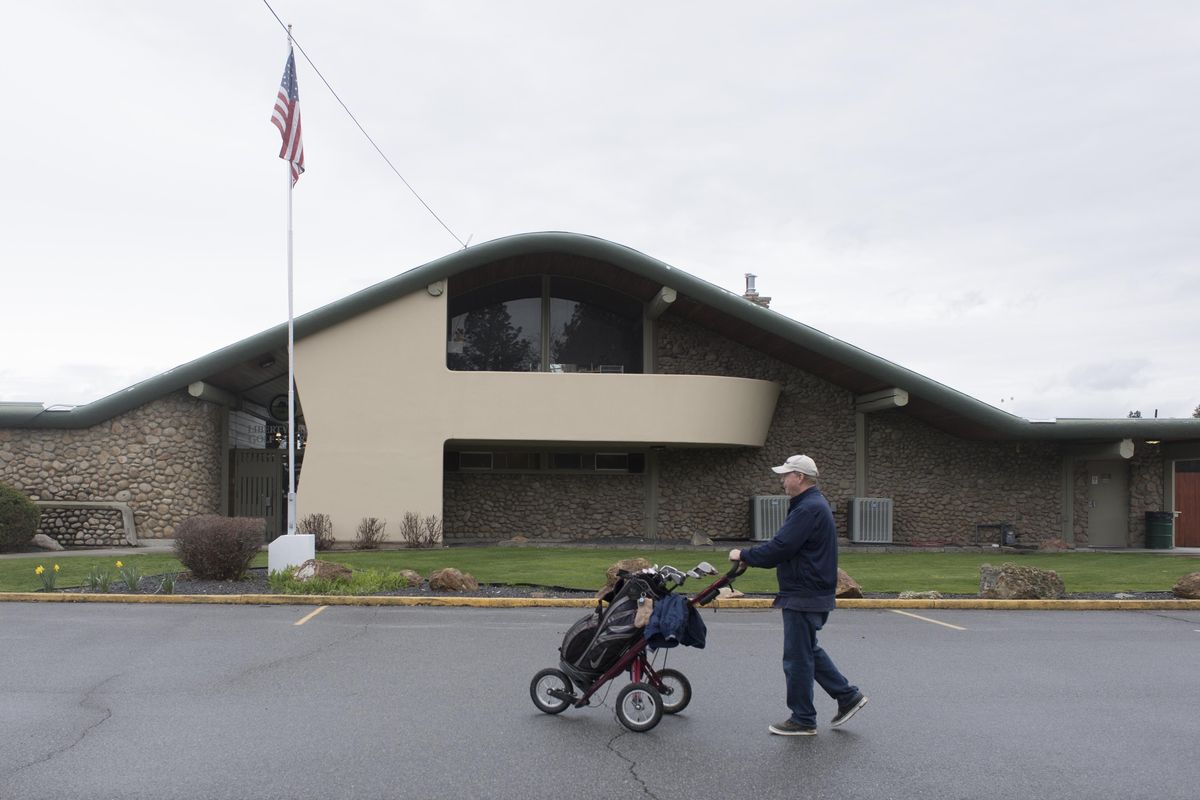 Present day: The 1959 clubhouse, built the year that the Liberty Lake Golf Course  opened, is still in use, shown Thursday, April 13, 2017. The midcentury design from architect Warren Heylman is supported by massive, rustic beams that are exposed inside. (Jesse Tinsley / The Spokesman-Review)