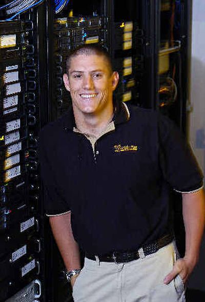 
Lance Larson, CEO of OC Hosting, stands by his web servers at company headquarters in San Clemente, Calif.
 (Associated Press / The Spokesman-Review)