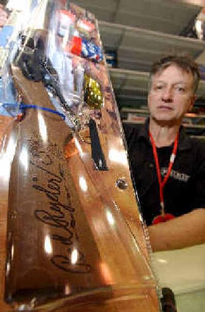 
A Little Rock, Ark., sporting goods store employee shows a packaged Daisy Red Ryder BB gun.
 (Associated Press / The Spokesman-Review)