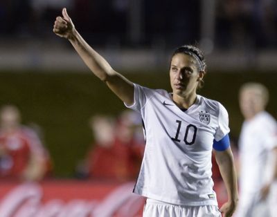 United States' Carli Lloyd (10) looks toward fans after the United States defeatedChina 1-0 in a quarterfinal match in the FIFA Women's World Cup soccer tournament, Friday, June 26, 2015, in Ottawa, Ontario, Canada. (Adrian Wyld / The Canadian Press via AP)