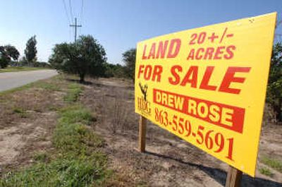 
A for-sale sign sits among acreage of orange trees in Bartow, Fla. Across Florida's citrus belt, farmers are replanting fewer trees than any point since the 1970s, and crop land is rapidly disappearing. Associated Press
 (Associated Press / The Spokesman-Review)