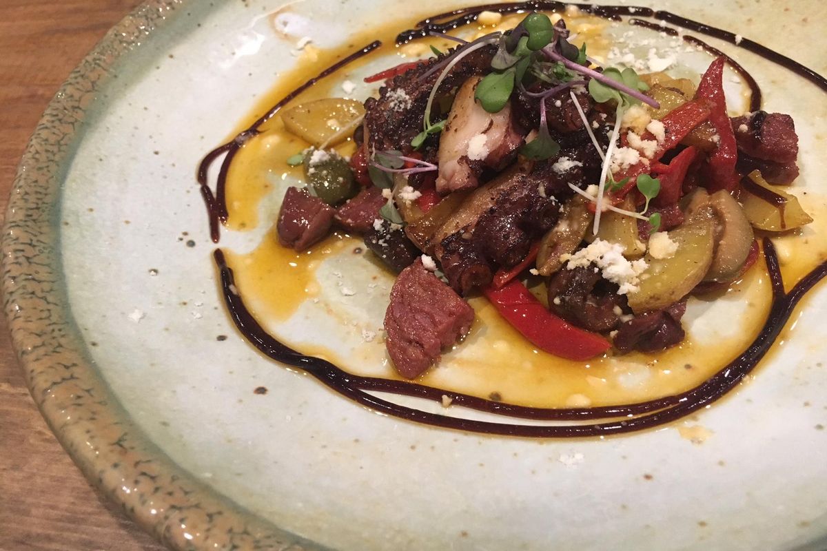 The charred Spanish octopus appetizer at the new Cochinito Taqueria in downtown Spokane features dry chorizo, olives, potatoes, roasted chilies, balsamic and garlic-chili oil. (Adriana Janovich / The Spokesman-Review)
