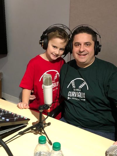 Joseph D’Avirro, 9, and his dad, Mike D’Avirro, host the sports-focused podcast “Sliders & Curveballs.”  (Family photo)