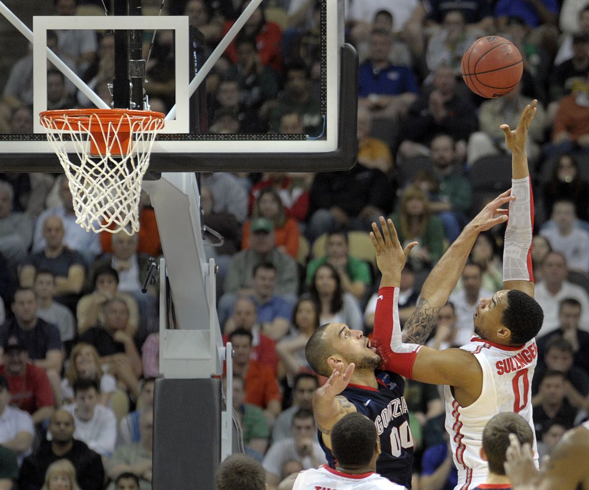 Ohio State’s Jared Sullinger, right, scores against Gonzaga’s Robert Sacre during the final minutes of their NCAA tournament game. (Christopher Anderson)