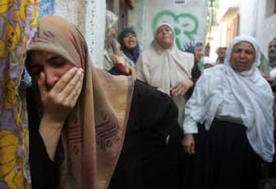 
Relatives of Palestinian Islamic Jihad militant Khalil Daeifi react outside the family house during his funeral Thursday in Gaza City. Associated Press
 (Associated Press / The Spokesman-Review)