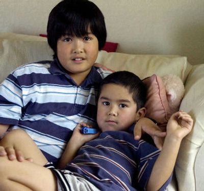 
Ten-year-old Joshua Calero, left, and his 5-year-old brother Jason Calero were left alone by their parents who went on a five-day vacation in Las Vegas.
 (Associated Press / The Spokesman-Review)