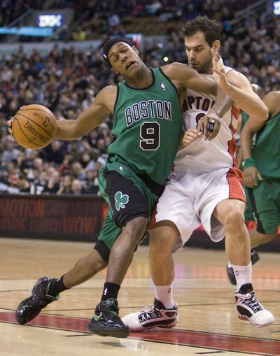 Rajon Rondo (9) had triple-double for Celtics against Raptors on Sunday.  (Associated Press)