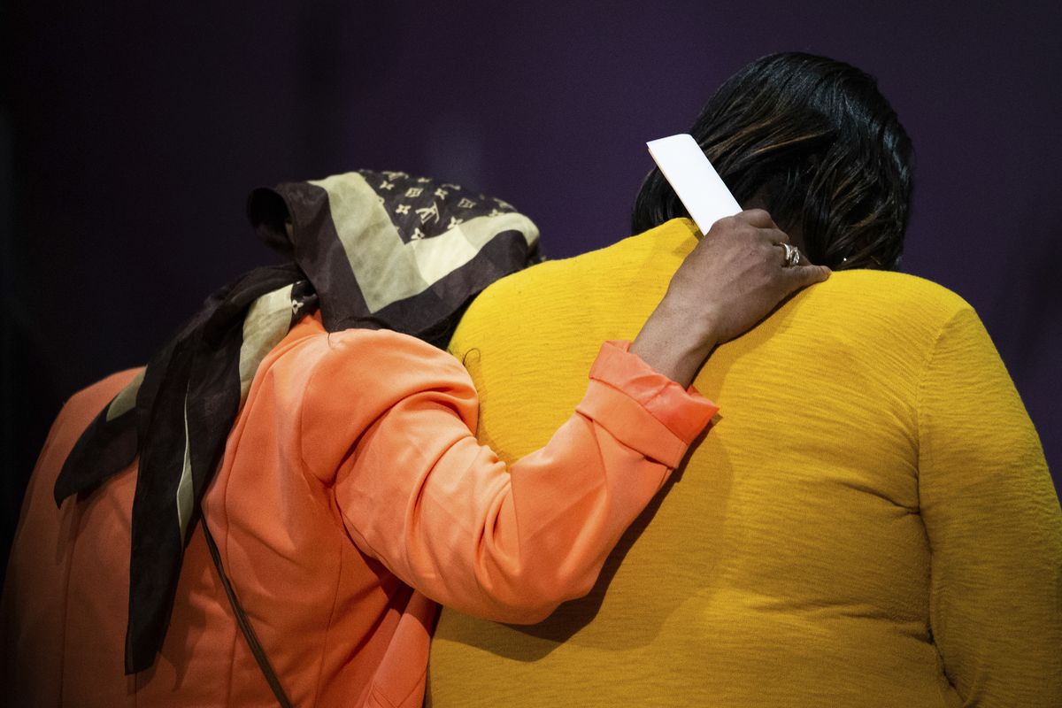 Worshippers impacted by the shooting at a Buffalo supermarket pray at True Bethel Baptist Church on Sunday, May 15, 2022, in Buffalo, N.Y.  (Joshua Bessex)