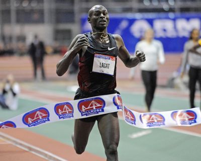 Bernard Lagat crosses finish line to win 5,000 in 13:07.15 at Millrose Games. (Associated Press)