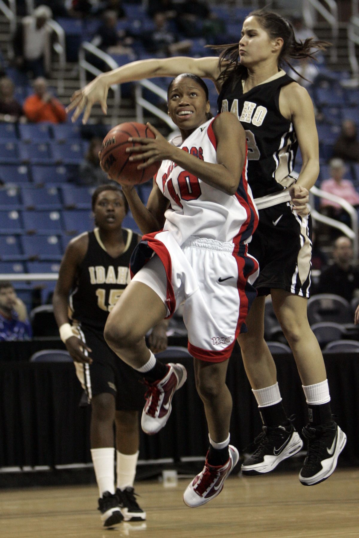 Fresno State’s LaShay Fears drives to the basket against Idaho’s Shaena Kuehu.  (Associated Press)