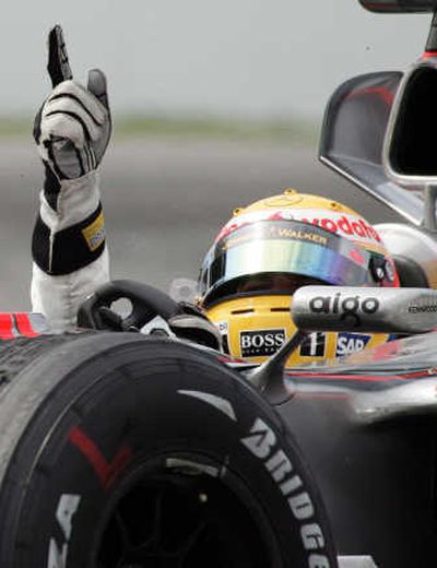 
Lewis Hamilton celebrates his historic victory. Associated Press
 (Associated Press / The Spokesman-Review)