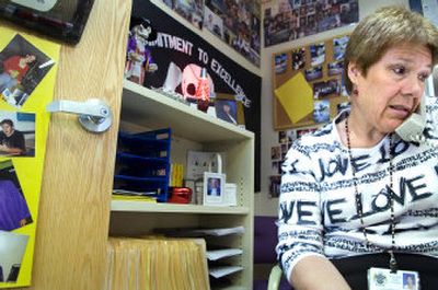 
Intervention specialist Barb Farnsworth tries to call a student at home on Tuesday from her office at Rogers High School. She has had hundreds of one-on-one interactions with students who need extra help in school or in life. She has been working with high-risk students at the school for 24 years. 
 (Holly Pickett / The Spokesman-Review)