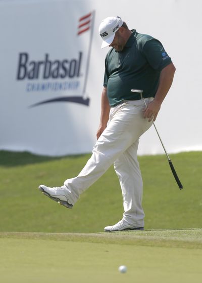 Jason Gore reacts after missing a putt on the 18th green during the third round of the Barbasol golf tournament. He is tied for second. (Associated Press)
