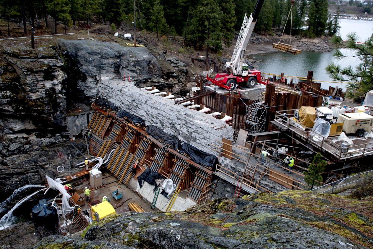 Workers constructed a cofferdam at the 1906 Post Falls dam during a 2015 renovation. Avista officials say ongoing capital investment is behind its ongoing requests for higher rates. (Kathy Plonka / The Spokesman-Review)