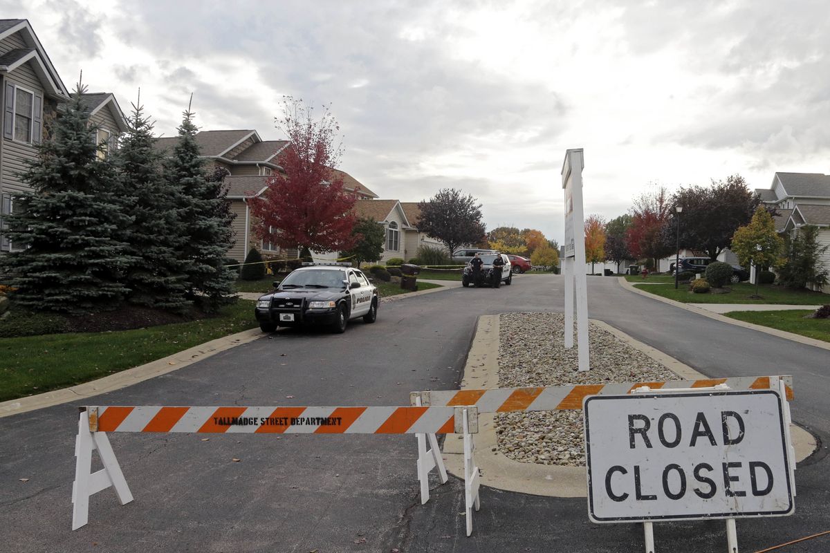 Police cordon off a home Wednesday in Tallmadge, Ohio, where Ebola-infected nurse Amber Vinson stayed last weekend before flying home to Dallas. (Associated Press)