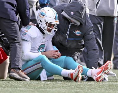 Miami Dolphins quarterback Matt Moore sits on the field after being hit by Pittsburgh Steelers' Bud Dupree in the first half of an AFC wild-card NFL football game in Pittsburgh on Sunday, Jan. 8, 2017. (Charles Trainor Jr / Associated Press)