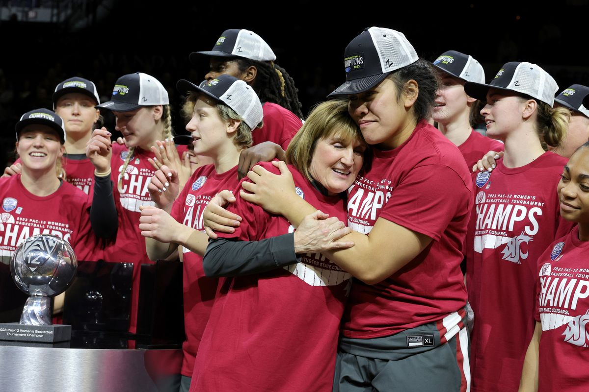 Washington State women’s basketball coach Kamie Ethridge gets a hug from Ula Motuga as the Cougars celebrate last Sunday’s Pac-12 Tournament win over UCLA in Las Vegas.  (Getty Images)