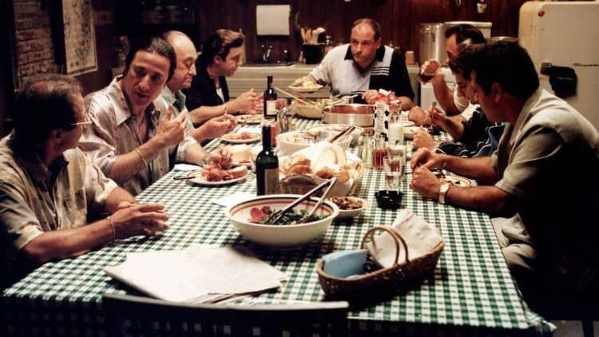 A dinner table scene from “The Sopranos,” highlighting a wide spread of Italian cuisine.  (Screenshot/HBO)