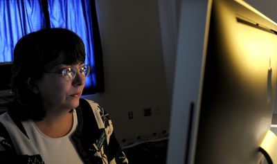 Senior librarian specialist Charlotte Robertson-Limesand works in the new video editing room at the Post Falls Library on Monday.  (Kathy Plonka / The Spokesman-Review)