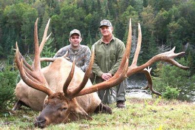 
Guide Tony Barber, left, confirmed that this bull elk was not killed in Idaho, but rather on a game farm in Quebec.  
 (Internet photo / The Spokesman-Review)