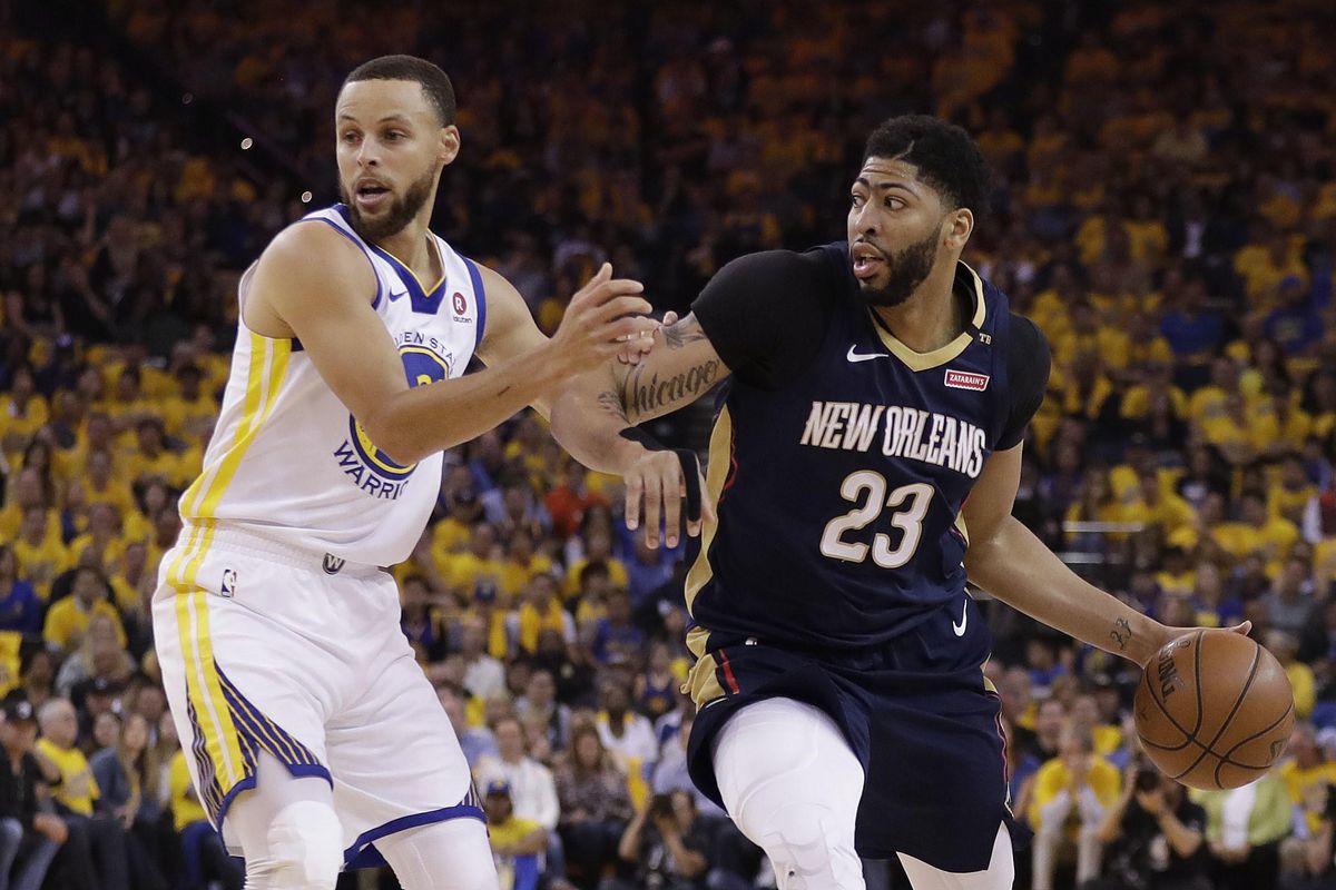 New Orleans Pelicans’ Anthony Davis, right, dribbles next to Golden State Warriors’ Stephen Curry during the first half in Game 5 of an NBA basketball second-round playoff series Tuesday, May 8, 2018, in Oakland, Calif. (Marcio Jose Sanchez / Associated Press)