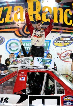 Timothy Peters, driver of the #17 Parts Plus Toyota, celebrates in Victory Lane after winning the NASCAR Camping World Truck Series American Ethanol 200 at Iowa Speedway on July 13, 2013 in Newton, Iowa. (Photo Credit: Jamie Squire/NASCAR via Getty Images) (Jamie Squire / Nascar)