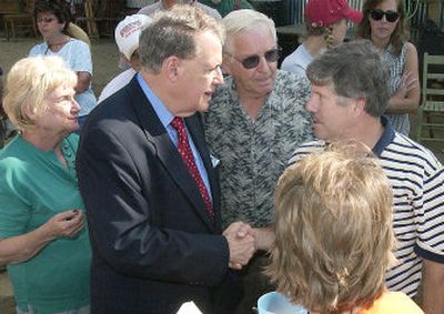 
U.S. Rep. Charles Taylor, R-N.C., shakes hands with Jay Lee in Asheville, N.C., in September 2004. Taylor faces a strong re-election challenge from Democrat Heath Shuler. 
 (File Associated Press / The Spokesman-Review)