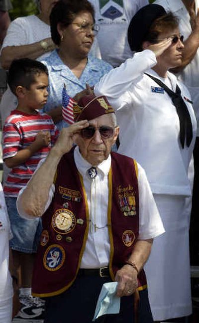 
Veteran and former POW Frank Stecklein, 91, salutes during a Memorial Day service at Fort Sam Houston National Cemetery in San Antonio. 
 (Associated Press / The Spokesman-Review)