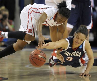 Gonzaga's Haiden Palmer (3) and Rutger's Erica Wheeler fall as they chase a loose ball  in the first half of an NCAA tournament first-round woman's game Saturday, March 17, 2012, in the McCarthey Athletic Center in Spokane, Wash. (Colin Mulvany / The Spokesman-Review)