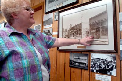 
Historical Society treasurer Vickie Eagle points to an old photograph of downtown Post Falls in the Post Falls Museum. 
 (Jesse Tinsley / The Spokesman-Review)