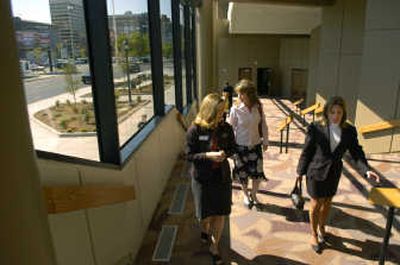 
Traci Everts, sales manager for the Spokane Public Facilities District, left, leads Stacey Davis and Cindy McLaughlin, right, on a tour around the newly upgraded INB Performing Arts Center on Thursday. 
 (Dan Pelle / The Spokesman-Review)