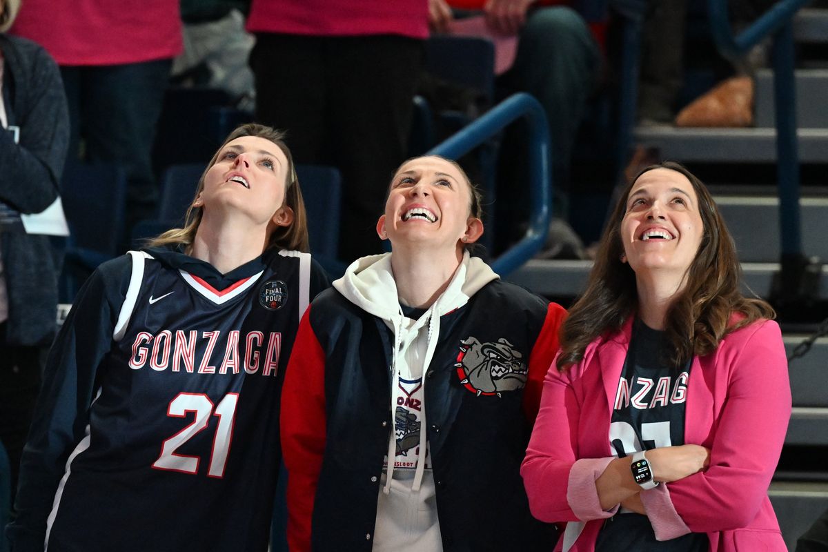 GU’s Courtney Vandersloot, center, reacts with her wife Allie Quigley and Gonzaga Bulldogs head coach Lisa Fortier during the first half of a college basketball game on Saturday, Feb 2023, at McCarthey Athletic Center in Spokane, Wash.  (Tyler Tjomsland/The Spokesman-Review)