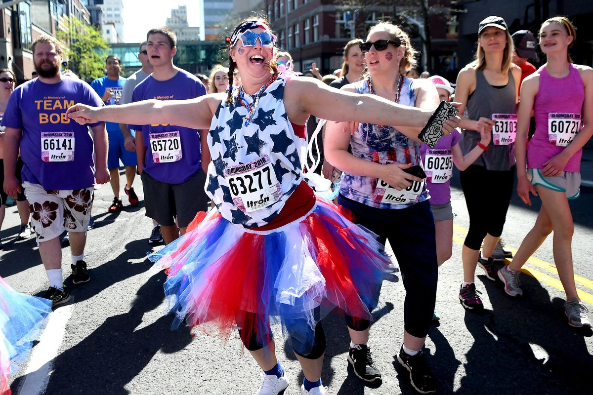 Kim Horisberger, center, poses for a picture at the 2018 Lilac Bloomsday  race on Sunday, May 6, 2018. (Kathy Plonka / The Spokesman-Review)