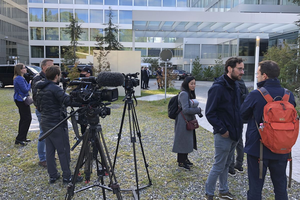 Members of the media gather outside an hotel in Zurich, Switzerland where a meeting between US and Chinese officials was taking place on Wednesday Oct. 6, 2021. President Joe Biden is dispatching White House national security adviser Jake Sullivan for talks with senior Chinese foreign policy adviser Yang Jiechi in Switzerland as the two countries find themselves at odds on a variety of issues, including Taiwan and trade.  (Jamey Keaten)